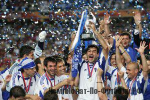 LISBON, PORTUGAL - JULY 4:  Traianos Dellas of Greece lifts the trophy during the UEFA Euro 2004 Final match between Portugal and Greece at the Luz Stadium on July 4, 2004 in Lisbon, Portugal. (Photo by Alex Livesey/Getty Images)